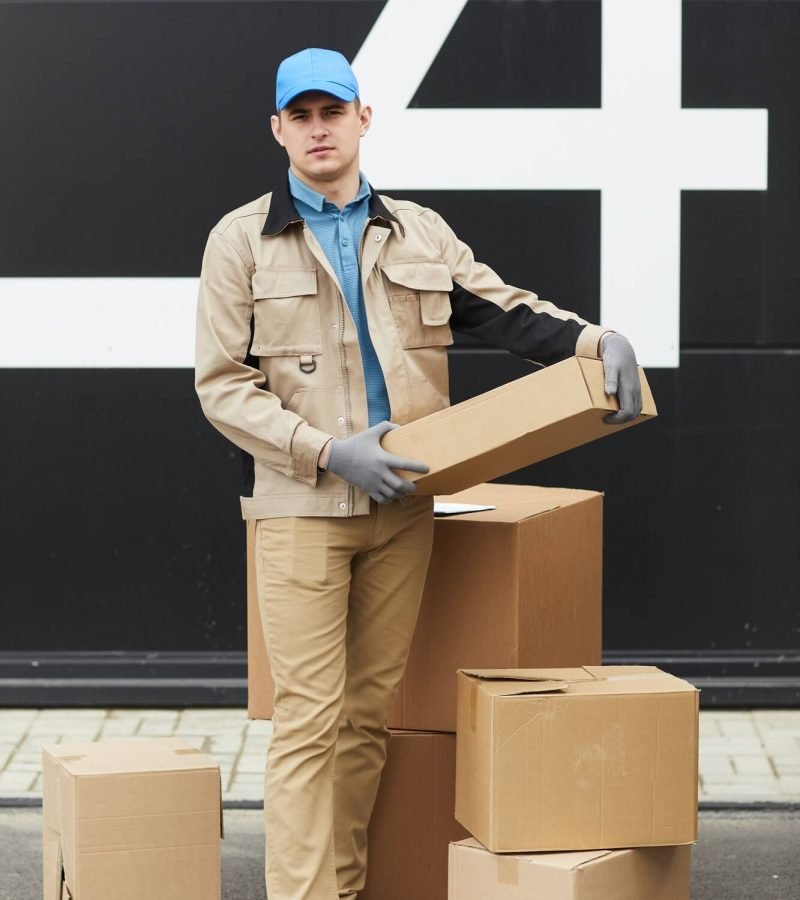 courier-working-with-parcels-in-warehouse-1.jpg